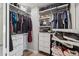 Large walk-in closet with ample shelving and drawers at 8856 E Altadena Ave, Scottsdale, AZ 85260