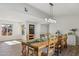 Bright dining room with farmhouse table and chandelier at 8856 E Altadena Ave, Scottsdale, AZ 85260