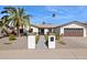Beautiful single-story home with landscaped front yard and a two-car garage at 8856 E Altadena Ave, Scottsdale, AZ 85260