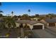 Modern single story home with landscaped yard and two car garage at 8856 E Altadena Ave, Scottsdale, AZ 85260