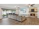 Spacious living area with hardwood floors, fireplace, and sliding glass doors at 8856 E Altadena Ave, Scottsdale, AZ 85260