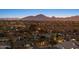 Scenic neighborhood view with mountain backdrop at sunset at 8856 E Altadena Ave, Scottsdale, AZ 85260