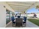 Covered patio with outdoor dining set and pool view at 8856 E Altadena Ave, Scottsdale, AZ 85260
