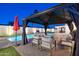 Relaxing poolside patio with gazebo and comfortable seating at 8856 E Altadena Ave, Scottsdale, AZ 85260