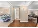 Bright hallway with wood-look floors leading to bedroom and living room at 9550 N 94Th Pl # 111, Scottsdale, AZ 85258