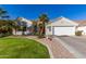 Single-story home with a two-car garage, landscaping, and a manicured lawn at 962 S Jacob St, Gilbert, AZ 85296