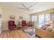 Bright living room featuring comfortable seating, a dining area, and access to a patio at 10254 W Palmeras Dr, Sun City, AZ 85373