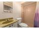 Bathroom with shower stall, toilet, and vanity sink at 10618 N 73Rd Dr, Peoria, AZ 85345