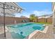 Enjoy this beautiful pool with striped umbrellas and comfortable seating at 10713 E Hawk Ave, Mesa, AZ 85212