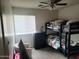 Bedroom with bunk beds, window coverings, and dresser at 125 N Sunvalley Blvd # 102, Mesa, AZ 85207