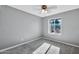 Well-lit bedroom featuring a window and ceiling fan at 12660 N 42Nd Dr, Phoenix, AZ 85029