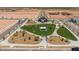 Aerial view of a community park with green spaces and gathering areas at 1304 W Golden Ore Pass, Apache Junction, AZ 85120