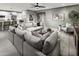 Bright Gathering room with sectional sofa, large TV, and sliding glass doors at 1304 W Golden Ore Pass, Apache Junction, AZ 85120