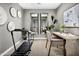 Private home gym with treadmill and mirrors at 1304 W Golden Ore Pass, Apache Junction, AZ 85120