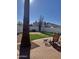 Landscaped backyard with patio and artificial turf at 1401 W Ocotillo Rd, Phoenix, AZ 85013