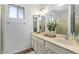 Double vanity bathroom with a large mirror and shower at 1401 W Ocotillo Rd, Phoenix, AZ 85013