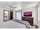 Main bedroom with large TV and plenty of dresser space at 1401 W Ocotillo Rd, Phoenix, AZ 85013