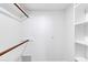 White closet with wood shelving and hanging rods at 1401 W Ocotillo Rd, Phoenix, AZ 85013
