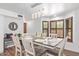Casual dining area with wood table and white chairs near kitchen at 1401 W Ocotillo Rd, Phoenix, AZ 85013