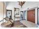 Bright entryway with wood floors, chandelier, and seating area at 1401 W Ocotillo Rd, Phoenix, AZ 85013