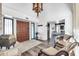 Entryway with wood floors, chandelier, and seating area at 1401 W Ocotillo Rd, Phoenix, AZ 85013