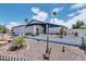 White mid-century modern home with desert landscaping at 1401 W Ocotillo Rd, Phoenix, AZ 85013