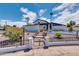 Stunning mid-century modern home with landscaped yard and walkway at 1401 W Ocotillo Rd, Phoenix, AZ 85013