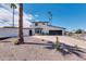 Modern home with black garage door and white fence at 1401 W Ocotillo Rd, Phoenix, AZ 85013