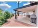 Covered patio, adjacent to backyard and grill at 1401 W Ocotillo Rd, Phoenix, AZ 85013