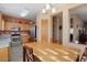 Bright dining area with wood table and chairs near kitchen at 14729 W Gunsight Dr, Sun City West, AZ 85375