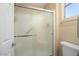 Shower stall with glass enclosure and tiled surround at 14729 W Gunsight Dr, Sun City West, AZ 85375