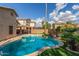 Sparkling backyard pool with lush landscaping, perfect for outdoor enjoyment and relaxation at 14995 W Desert Hills Dr, Surprise, AZ 85379