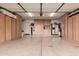 Spacious garage with ample storage cabinets at 14995 W Desert Hills Dr, Surprise, AZ 85379