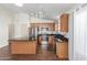 Well-lit kitchen with stainless steel appliances and a center island at 14995 W Desert Hills Dr, Surprise, AZ 85379