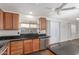 Kitchen featuring granite countertops, stainless steel appliances, and wood cabinets at 14995 W Desert Hills Dr, Surprise, AZ 85379