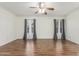 Well-lit living room with neutral walls and tile flooring at 14995 W Desert Hills Dr, Surprise, AZ 85379