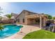 Backyard pool featuring a covered patio, perfect for outdoor entertaining and enjoying sunny days at 14995 W Desert Hills Dr, Surprise, AZ 85379