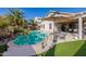 Stunning pool area, complete with patio furniture and lush landscaping at 14995 W Desert Hills Dr, Surprise, AZ 85379
