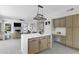 Modern kitchen with an island, stainless steel appliances, and white cabinets at 15071 N 49Th Way, Scottsdale, AZ 85254