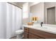 Clean bathroom with a single sink vanity and a shower/tub combo at 15320 W Baden St, Goodyear, AZ 85338