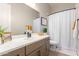 Simple bathroom with a single sink vanity and a shower/tub combo at 15320 W Baden St, Goodyear, AZ 85338
