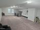 Expansive bonus room with ample natural light, ideal for entertaining or relaxation at 15320 W Baden St, Goodyear, AZ 85338