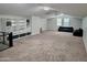 Large bonus room with custom built-in shelving and storage, offering versatile space at 15320 W Baden St, Goodyear, AZ 85338