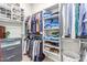 Spacious walk-in closet with ample shelving and hanging space at 15320 W Baden St, Goodyear, AZ 85338