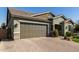 Two-car garage and attractive landscaping at 15320 W Baden St, Goodyear, AZ 85338