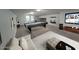 Open concept game room featuring a pool table, large television and an entertainment area at 15320 W Baden St, Goodyear, AZ 85338