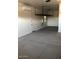 Spacious garage with overhead storage and epoxy flooring at 15320 W Baden St, Goodyear, AZ 85338