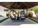 Covered patio with ceiling fan and comfortable seating at 15320 W Baden St, Goodyear, AZ 85338