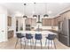 Modern kitchen with center island and gray shaker cabinets at 15320 W Baden St, Goodyear, AZ 85338