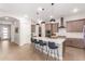 Eat-in kitchen with an island, stainless steel appliances, and modern cabinets at 15320 W Baden St, Goodyear, AZ 85338